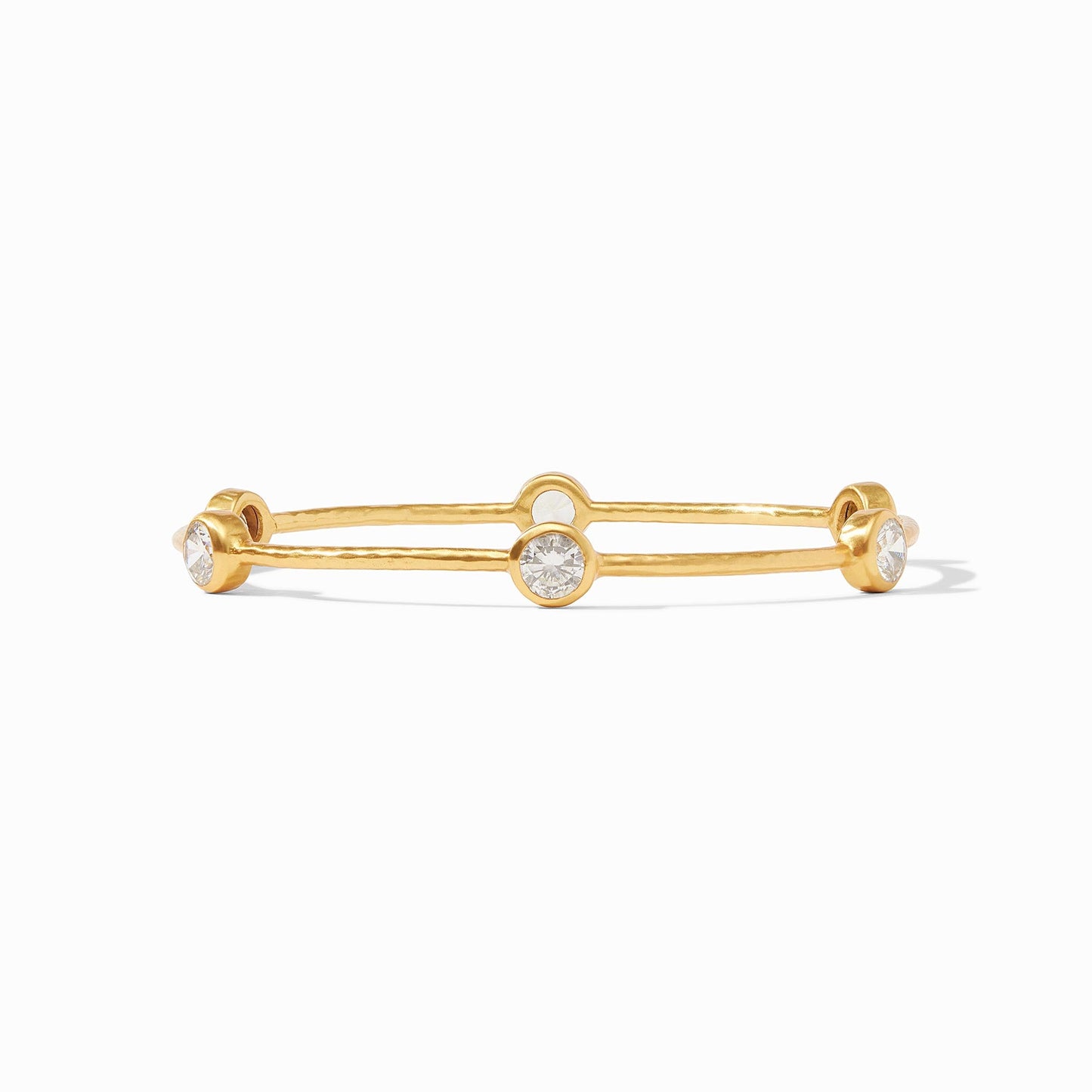 A lightly hammered bangle features six circular gemstones that sit along the length of this slim bangle, making it perfect for mixing and matching to create a striking color story on your wrist.