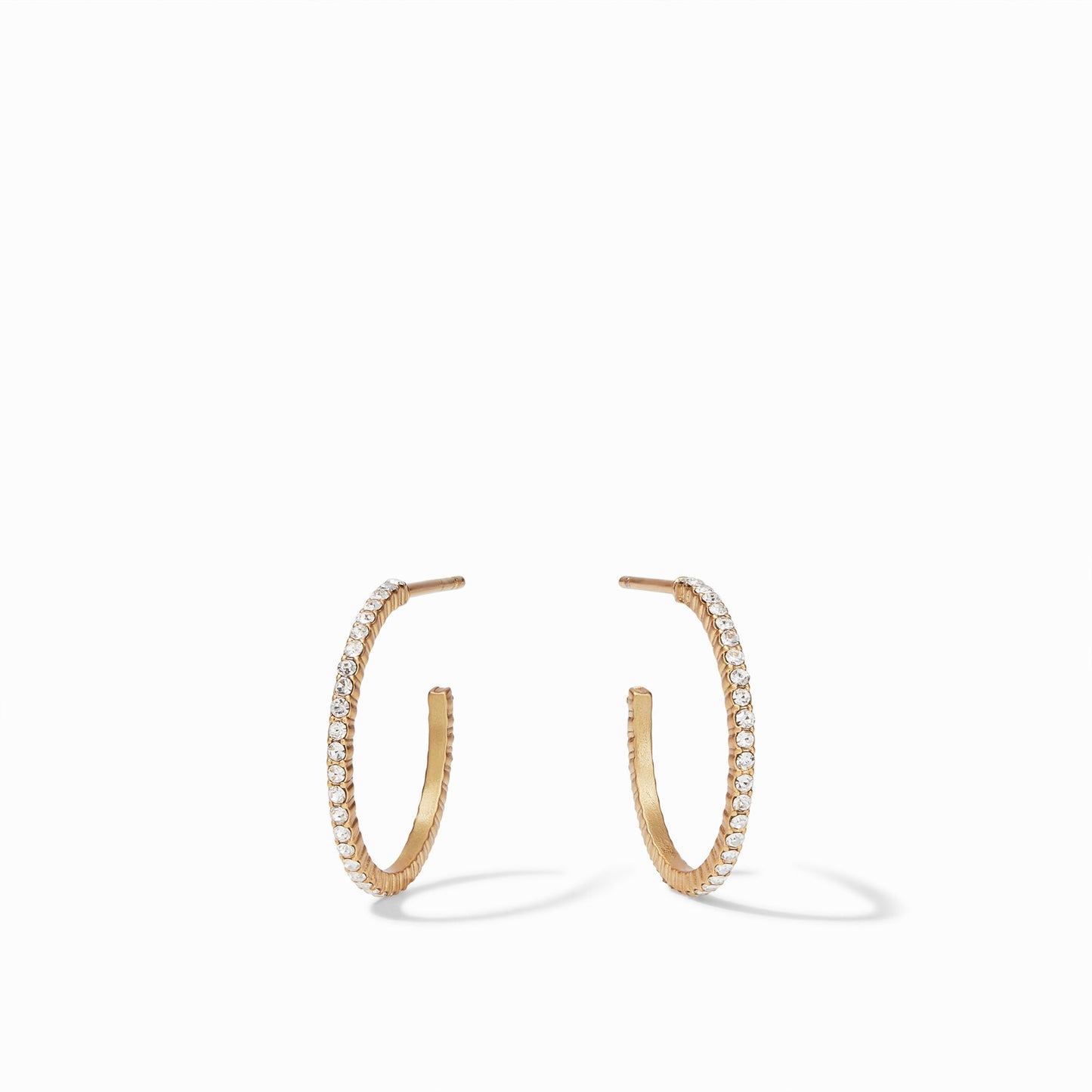 Sparkle and shine in a pair of striking CZ hoop earrings adorned with pavé CZ. These slender, thin hoops are available in four different sizes.