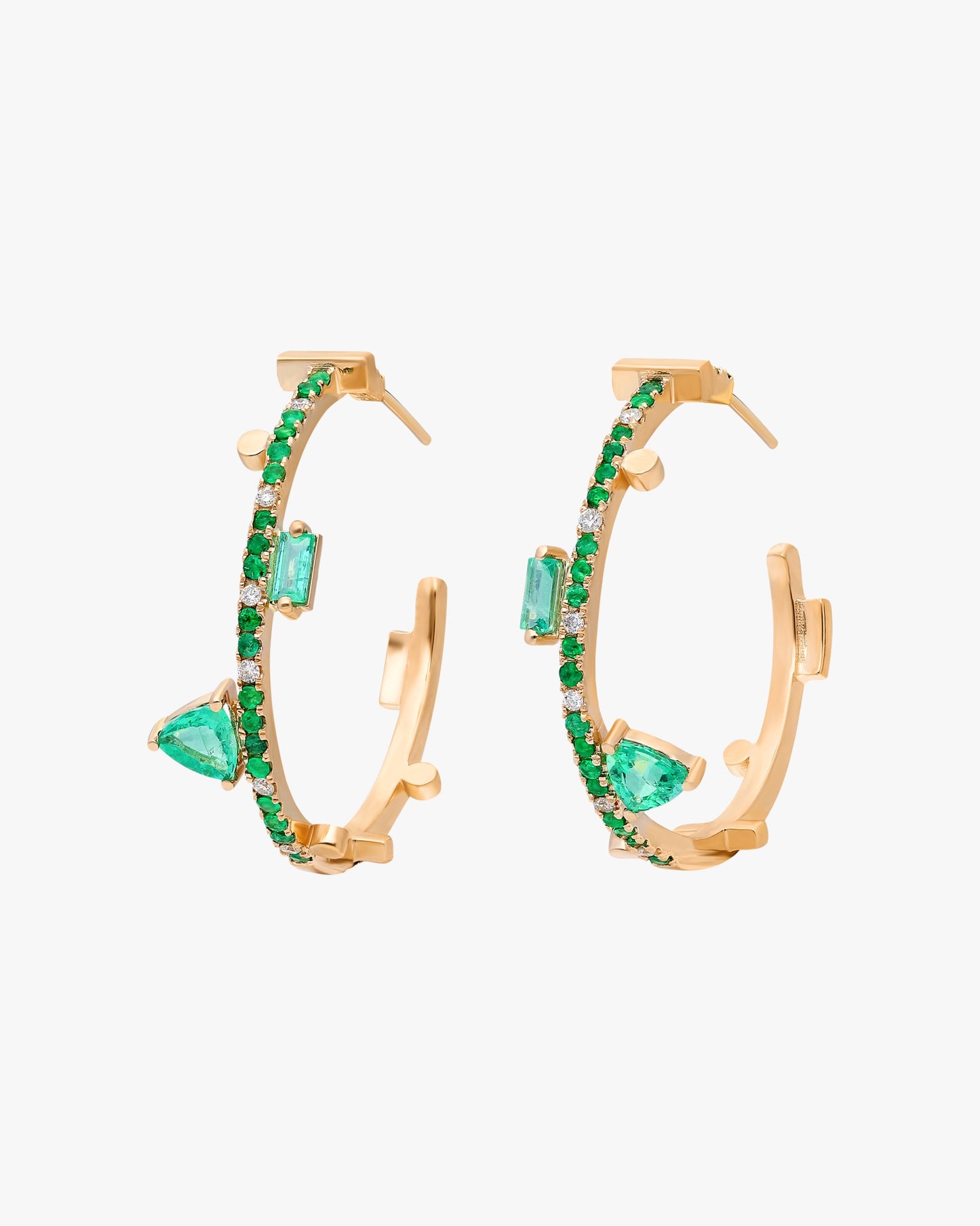 14k yellow gold and emerald Emerald: 1.56 tcw Spot clean Made in Turkey Instantly enliven your ensemble with these 14k gold hoop earrings that are trimmed in vibrant emeralds and feature geometric stations for an edgy look.