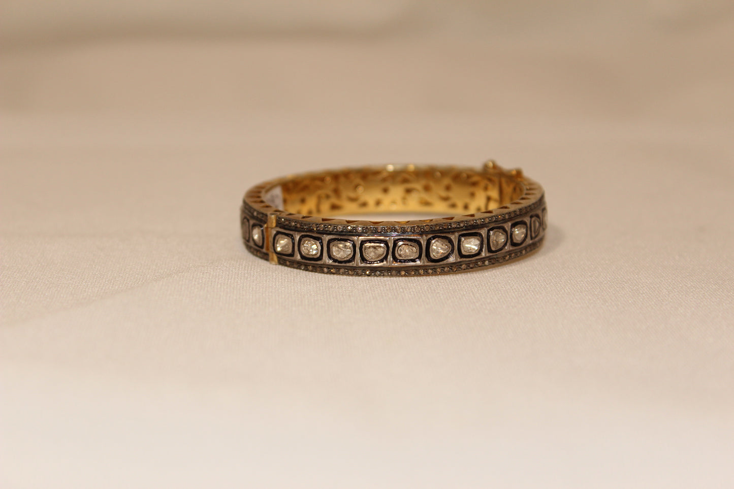 Rose cut diamond bangle with rhodium, oxidized sterling silver and yellow gold. Sourced from India