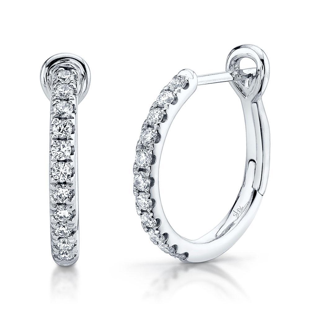 0.26CT 14K Y/G or W/G diamond hoop earring All of our designs are handmade and slight variations may exist. All Shy Creation items are hand set and all stones are natural and hand-picked. Each piece is unique and you can expect slight variations in the shade, hue, and tint of the color stones.