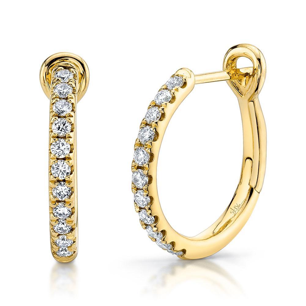0.26CT 14K Y/G or W/G diamond hoop earring All of our designs are handmade and slight variations may exist. All Shy Creation items are hand set and all stones are natural and hand-picked. Each piece is unique and you can expect slight variations in the shade, hue, and tint of the color stones.