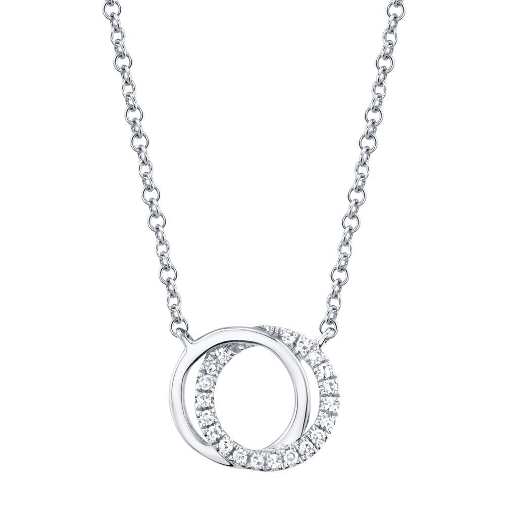 0.07CT DIAMOND LOVE KNOT CIRCLE PENDANT NECKLACE Shy Creation's classic love knot pendant necklace showcases a delicate interlocked knot design decorated with sparkling pave diamonds. A perfect 'just because' gift for someone special and can be worn alone or layer for a fashion forward look. EDITOR'S NOTES: 14K Yellow Gold Lobster Clasp Closure 0.07 Carat Weight Available in: Yellow, Rose, and White Gold.