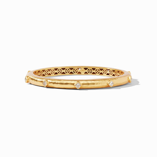 Ten diamond-shaped brilliant cut CZ gemstones embellish this lightly hammered bangle with a delicate piercework interior.