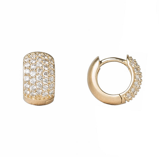These 14K gold dainty huggies feature five rows of diamond pavé and a hinged enclosure.  Available in 14k yellow or white gold  Satin finish  Hoop diameter is 11mm  Made in USA