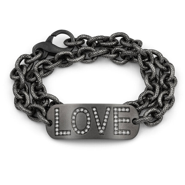 This bracelet features a satin finish sterling silver plate with “LOVE” spelled out in glittering diamonds, double-wrapped on our exclusive textured and oxidized chain.  Available with a dark rhodium finish  Includes a Liza Beth signature satin finish clasp  E/F color single cut diamonds  Made in USA