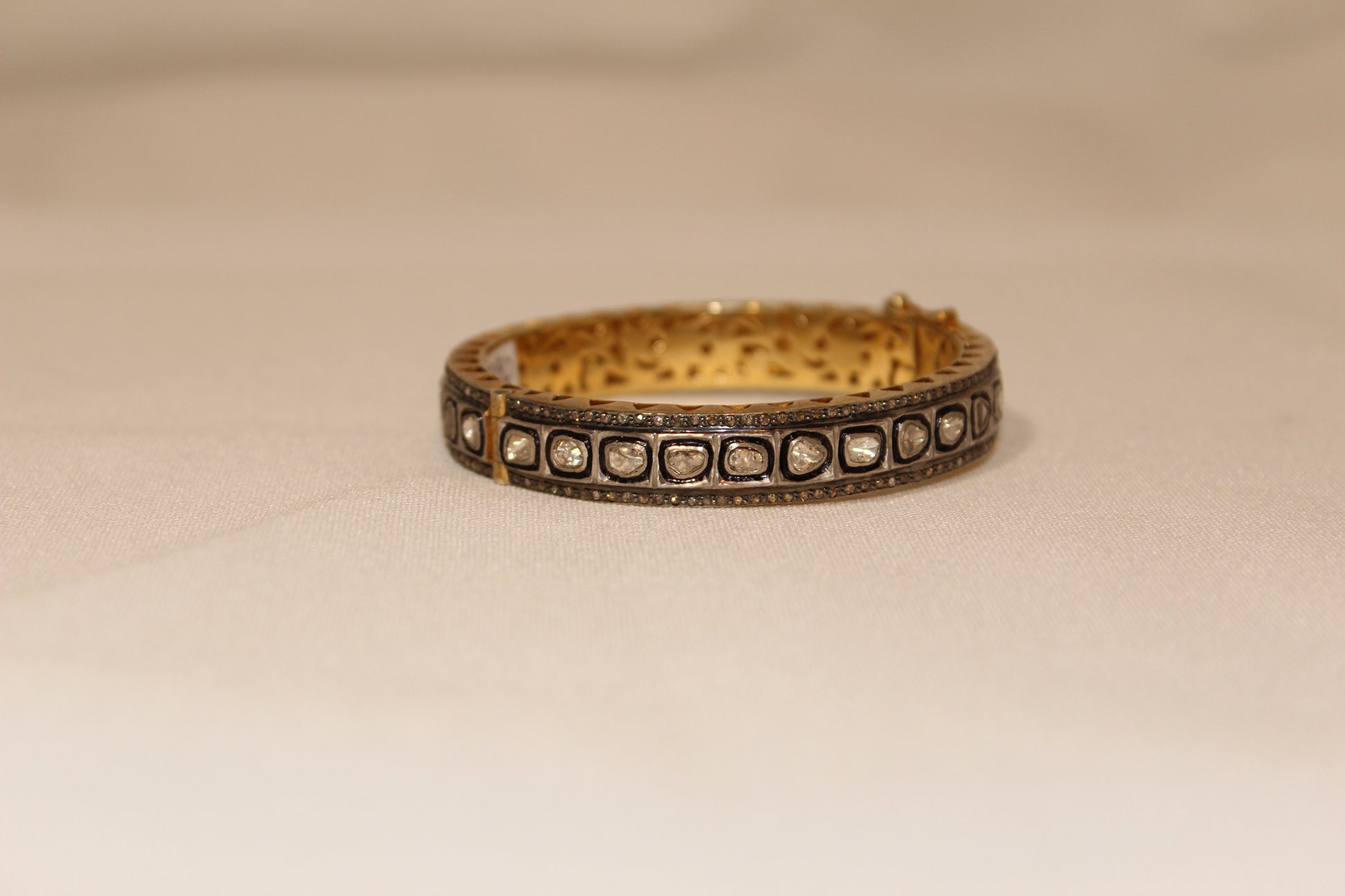 Rose cut diamond bangle with rhodium, oxidized sterling silver and yellow gold.  Sourced from India