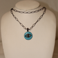Enamel evil eye, sapphire, diamond over sterling silver Sourced from India