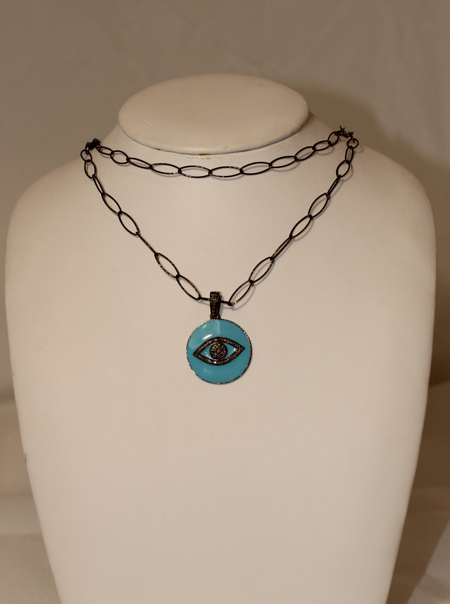 Enamel evil eye, sapphire, diamond over sterling silver Sourced from India